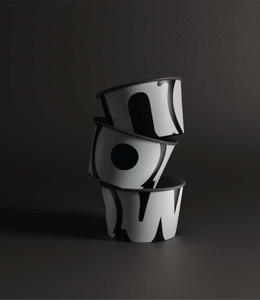 Naturals Now 黑白風格冰淇淋包裝設計，像奶油流動的白色大寫字母now