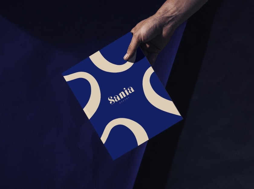 sania 烘培面包店品牌vi形象設計，寶藍色面包手繪線條輪廓圖案