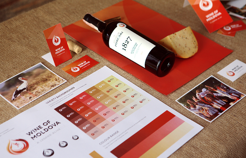 摩爾多瓦釀酒師協會logo設計“地圖+酒滴+葡萄+白鸛展翅+火”