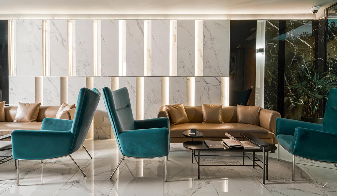 Ruco非手術美容與皮膚護理醫療logo設計vi設計。青黑色金色奢侈風與循環交叉線條-醫療中心內部空間設計